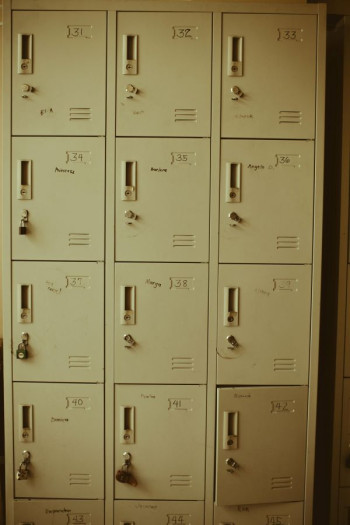 A series of yellowy cream metal lockers