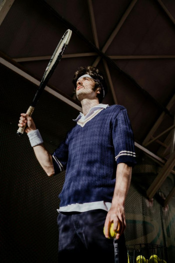 A man holding a tennis racquet