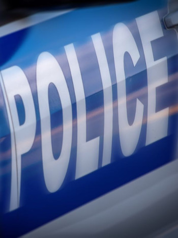 Close up image of the word 'Police' usually seen on a Police car