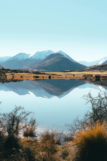 A scenic image of a lake and surrounding area