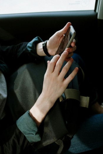 A woman's hands on a smartphone
